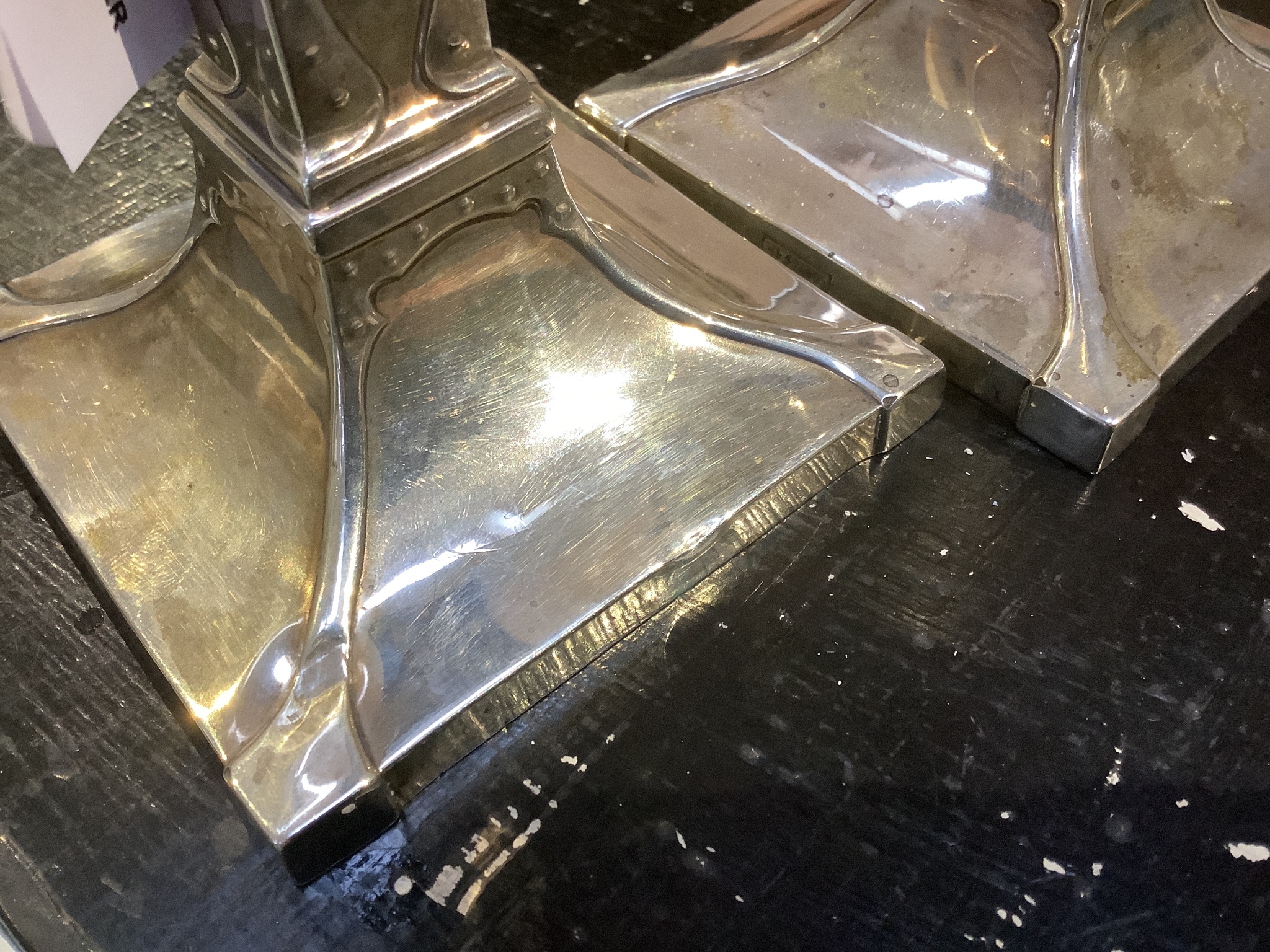 A pair of George V Arts & Crafts silver candlesticks, by William Hutton & Sons